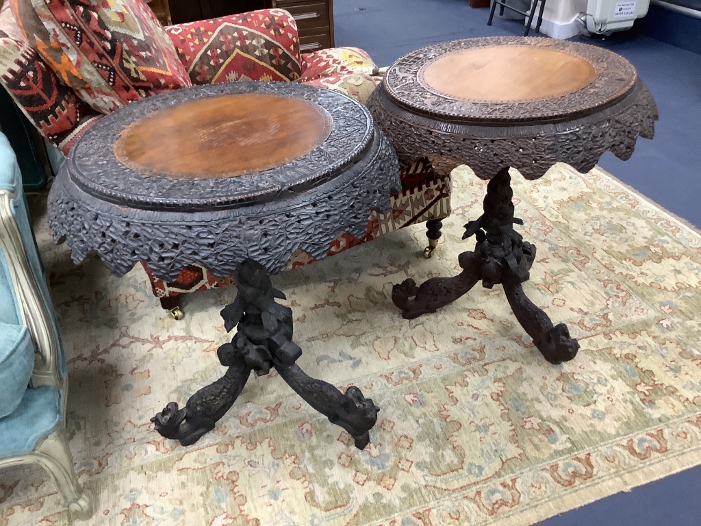 A near pair of 19th century Indian padouk tripod tables, 62cm diameter, height 70cm